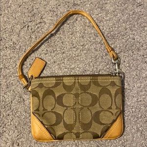 Coach Signature C wristlet.
